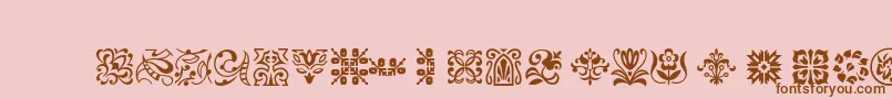 Ptornament-fontti – ruskeat fontit vaaleanpunaisella taustalla