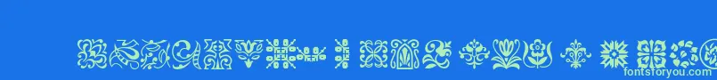 Ptornament Font – Green Fonts on Blue Background