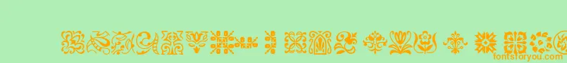 Ptornament Font – Orange Fonts on Green Background