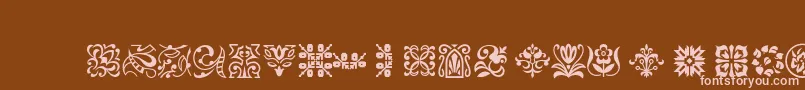 Ptornament-fontti – vaaleanpunaiset fontit ruskealla taustalla