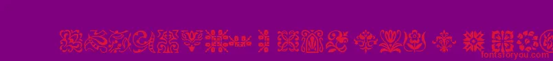 フォントPtornament – 紫の背景に赤い文字