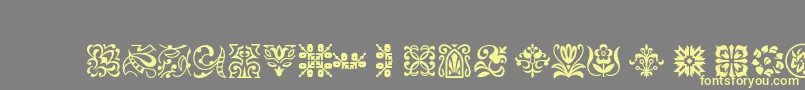 Ptornament-Schriftart – Gelbe Schriften auf grauem Hintergrund