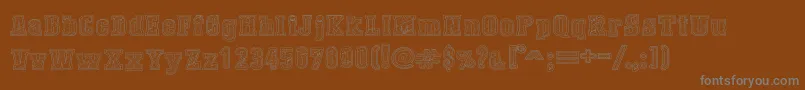 Czcionka DustWestCollege – szare czcionki na brązowym tle
