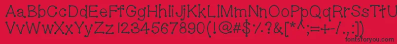 フォントGeldoticaplainlowercasef – 赤い背景に黒い文字