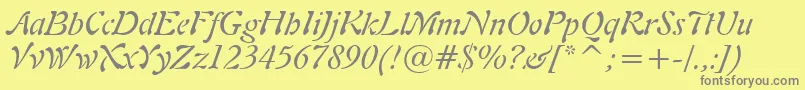 Freeform721ItalicBt-fontti – harmaat kirjasimet keltaisella taustalla