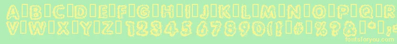 Carvings Font – Yellow Fonts on Green Background