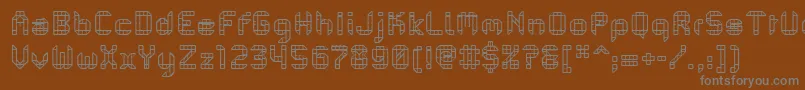 PfMechanicaBProComb-fontti – harmaat kirjasimet ruskealla taustalla