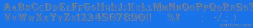 フォントWoodenShipDecorated – 青い背景に灰色の文字
