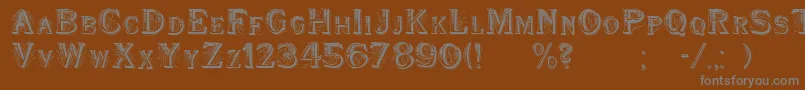 WoodenShipDecorated-fontti – harmaat kirjasimet ruskealla taustalla