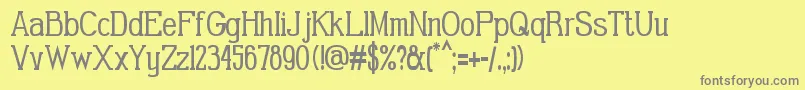 GabrielSerifCondensed-fontti – harmaat kirjasimet keltaisella taustalla