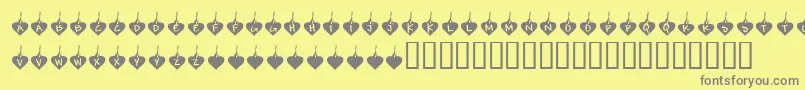 フォントKrBurningLove – 黄色の背景に灰色の文字