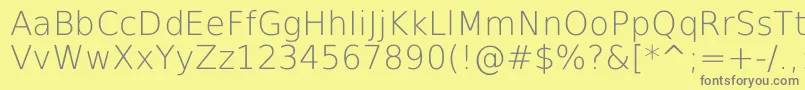 DejavuSansExtralight-fontti – harmaat kirjasimet keltaisella taustalla