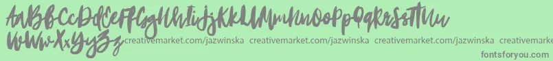 Portobesto-Schriftart – Graue Schriften auf grünem Hintergrund