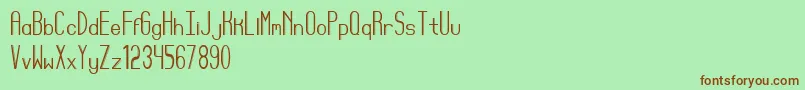 Reyes-Schriftart – Braune Schriften auf grünem Hintergrund