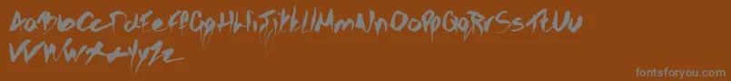 Gothicscribble-Schriftart – Graue Schriften auf braunem Hintergrund