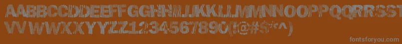 Hellawood Font – Gray Fonts on Brown Background