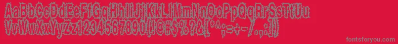 フォントShockthick – 赤い背景に灰色の文字