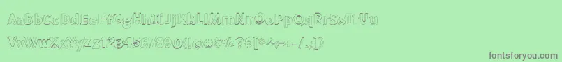 BmdMeatloafShadowOutline-Schriftart – Graue Schriften auf grünem Hintergrund