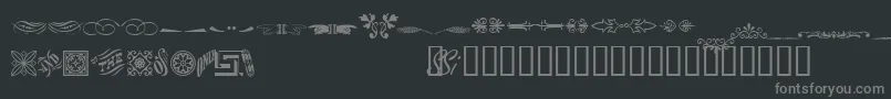 フォントWoodcutornamentstwossk – 黒い背景に灰色の文字