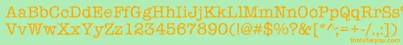 フォントIceaged – オレンジの文字が緑の背景にあります。