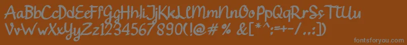 Gendhist-fontti – harmaat kirjasimet ruskealla taustalla