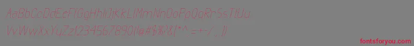 フォントExactaLightItalic – 赤い文字の灰色の背景