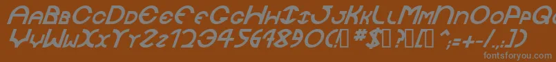 JaysetchBolditalic-fontti – harmaat kirjasimet ruskealla taustalla