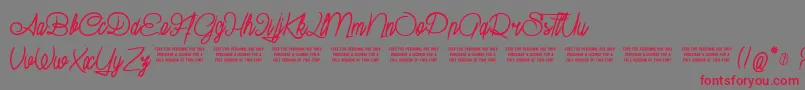 SuburbanPledge Font – Red Fonts on Gray Background
