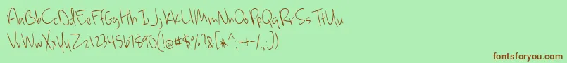 MckennaLight Font – Brown Fonts on Green Background