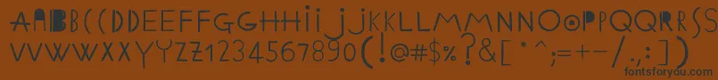 Шрифт EthnicabcRegularWebfont – чёрные шрифты на коричневом фоне