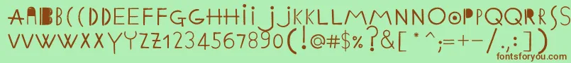 フォントEthnicabcRegularWebfont – 緑の背景に茶色のフォント
