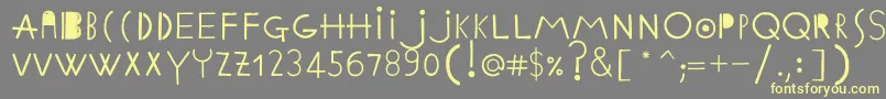 Czcionka EthnicabcRegularWebfont – żółte czcionki na szarym tle