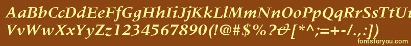 MeridienLtBoldItalic-fontti – keltaiset fontit ruskealla taustalla