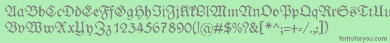 フォントWieynkfraktur – 緑の背景に灰色の文字