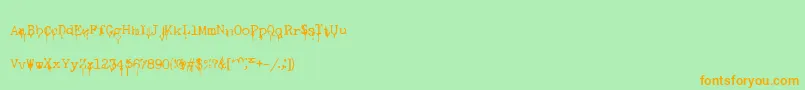 フォントNasalDrip – オレンジの文字が緑の背景にあります。