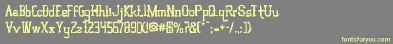 VloderstoneAntique3-fontti – keltaiset fontit harmaalla taustalla