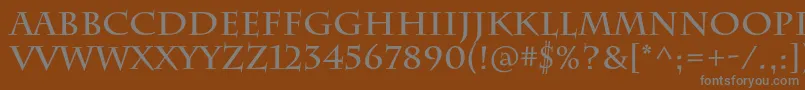 CharlemagnestdBold-fontti – harmaat kirjasimet ruskealla taustalla