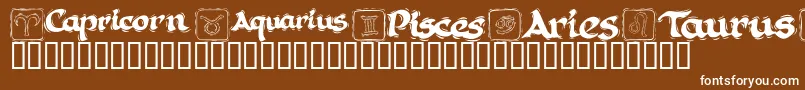 KrAstro1-Schriftart – Weiße Schriften auf braunem Hintergrund