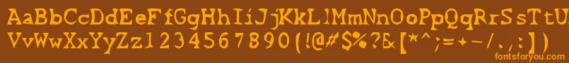 フォントScissorCuts2 – オレンジ色の文字が茶色の背景にあります。