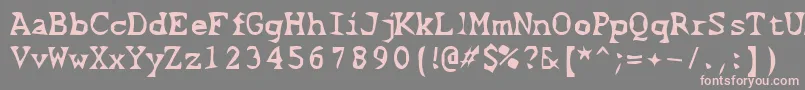 フォントScissorCuts2 – 灰色の背景にピンクのフォント