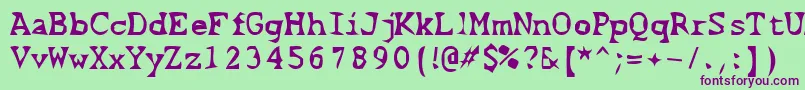 フォントScissorCuts2 – 緑の背景に紫のフォント