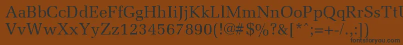 フォントMemoirRegular – 黒い文字が茶色の背景にあります