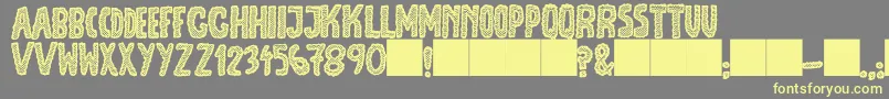 Шрифт JmhEscamasBlack – жёлтые шрифты на сером фоне
