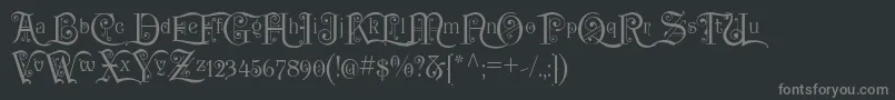 フォントP22KilkennyInitialCap – 黒い背景に灰色の文字