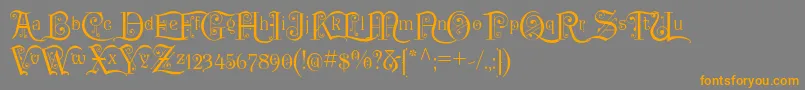 フォントP22KilkennyInitialCap – オレンジの文字は灰色の背景にあります。