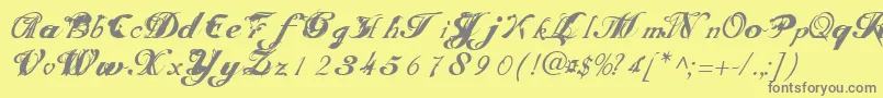 フォントScripteriatoid – 黄色の背景に灰色の文字