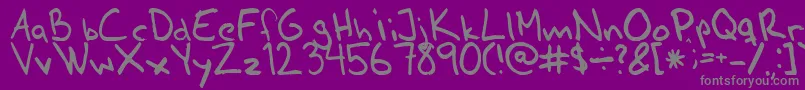 Ahnberghand-fontti – harmaat kirjasimet violetilla taustalla