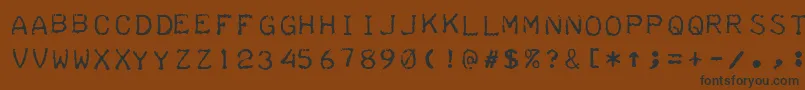 フォントTeleprinterIntalic – 黒い文字が茶色の背景にあります