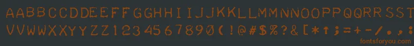 TeleprinterIntalic-fontti – ruskeat fontit mustalla taustalla