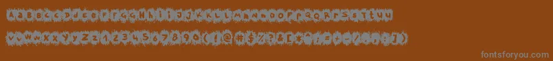 TpfKrikkelKrakkel Font – Gray Fonts on Brown Background